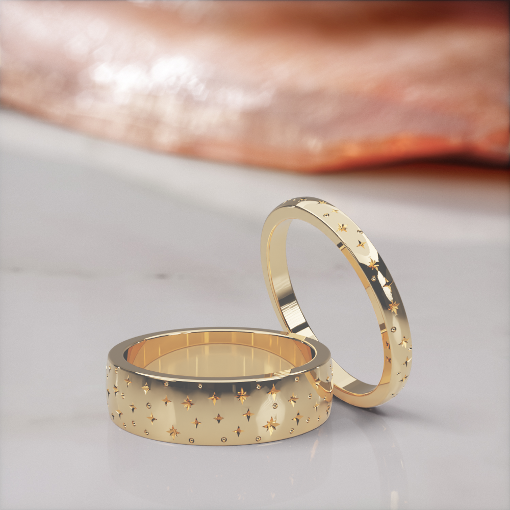 Starz wedding bands in yellow gold, the 5 mm and 2 mm engraved star bands as a pair