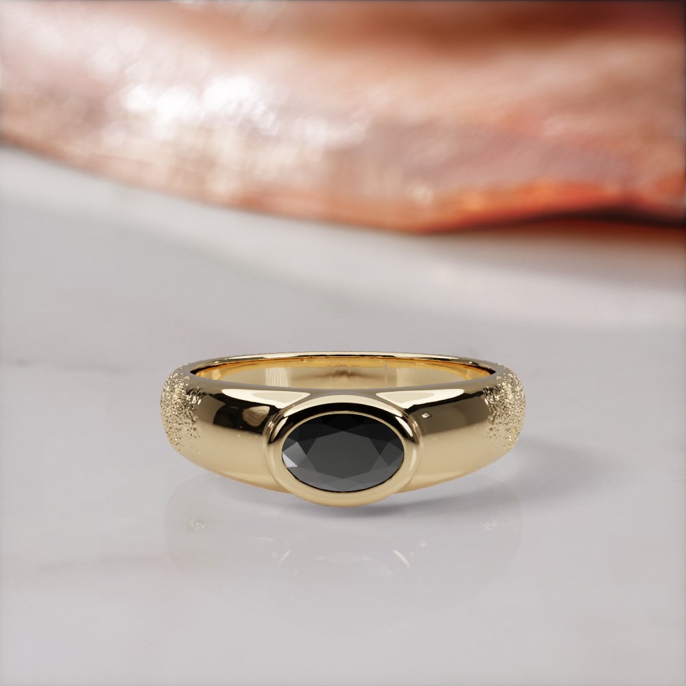 Smoothen engagement ring in yellow gold, front view of the black oval diamond in its smooth bezel