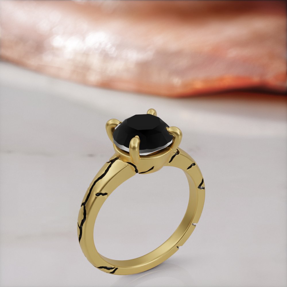 Kintsugi engagement ring in yellow gold with a round black diamond