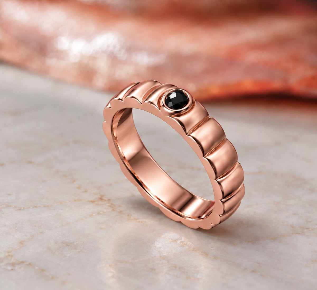 Gravitational Wave wedding band in rose gold, three-quarter view