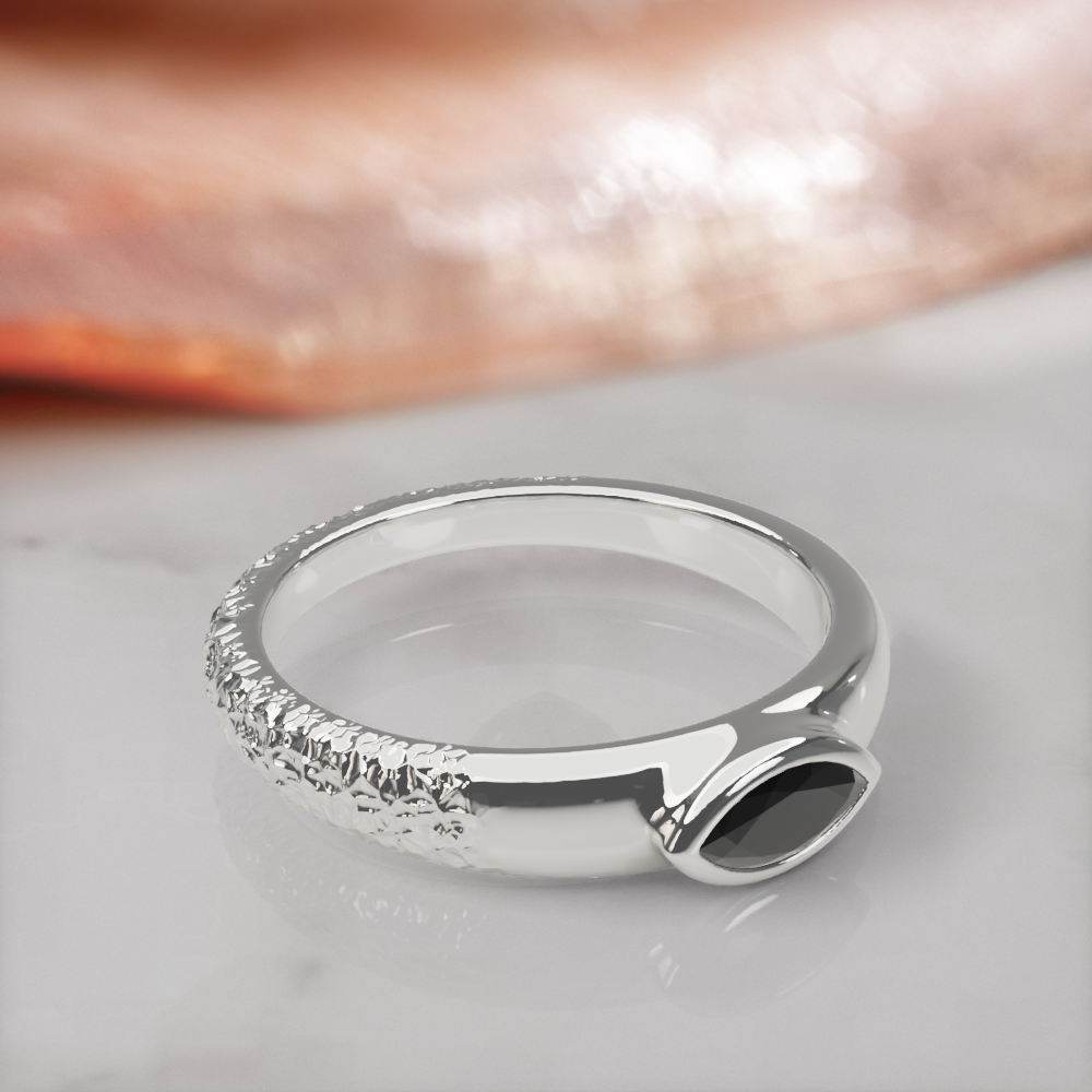 Disturbed engagement ring in white gold, three-quarter view showing the hammered, textured side of the band